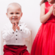 small boy and girl clapping: Emotional Storytelling through Children's Clothing Photography: The Power of Professional Photography