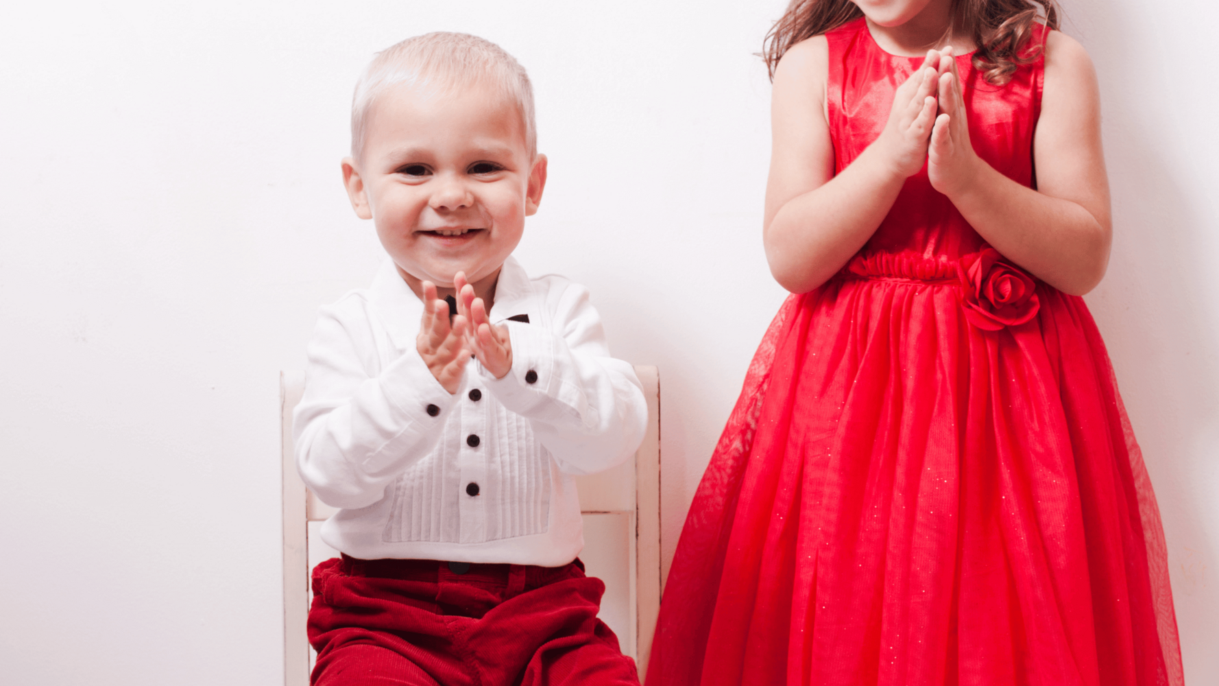 small boy and girl clapping: Emotional Storytelling through Children's Clothing Photography: The Power of Professional Photography