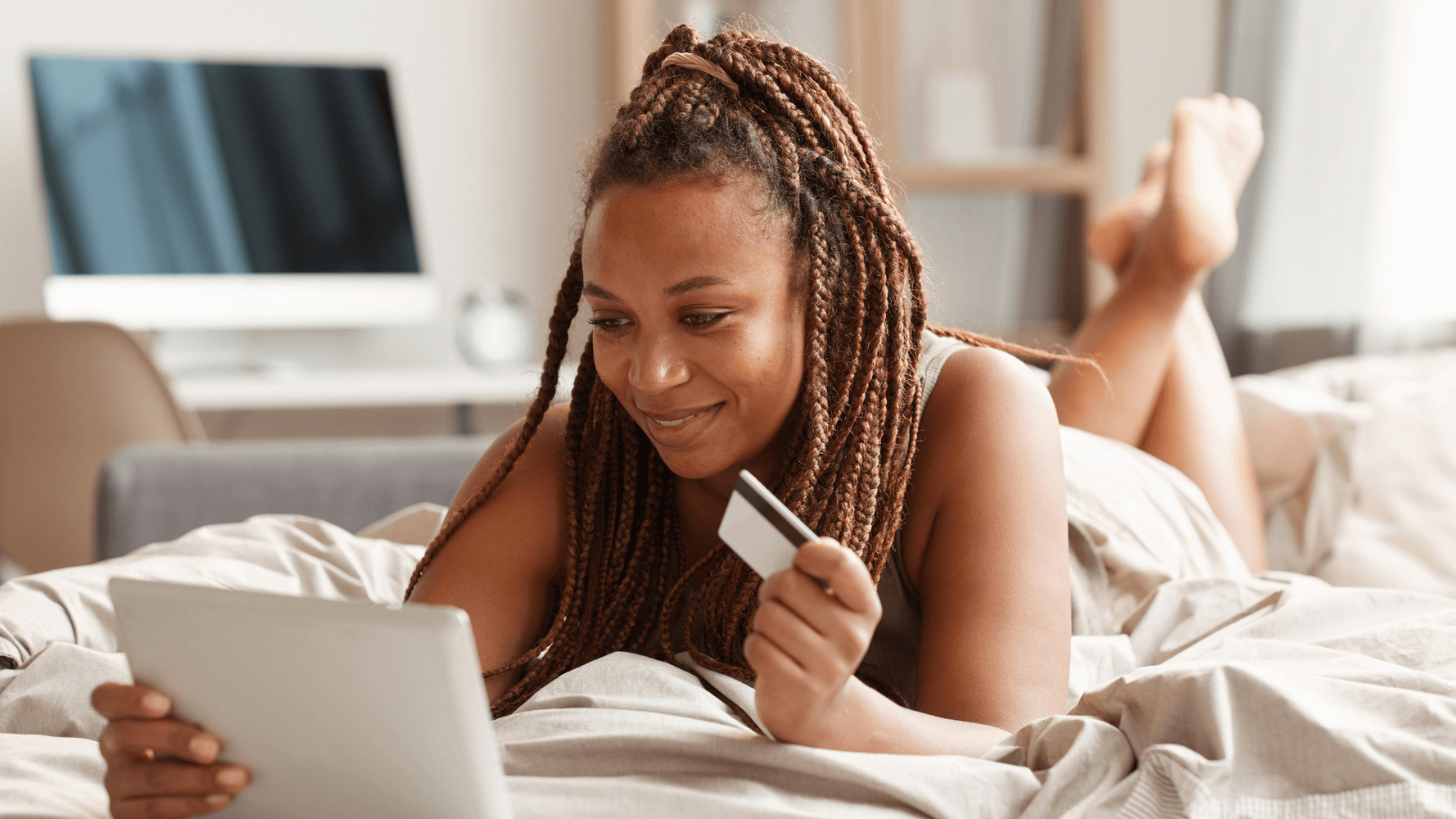 woman with credit card ready to make a purchase: gift of ghost mannequin technique